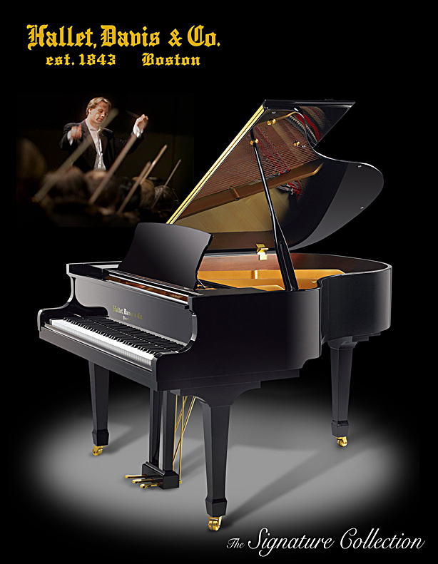 The Hallet Davis elite grand piano, model HS160 with ebony polish finish, shown in a spotlight.